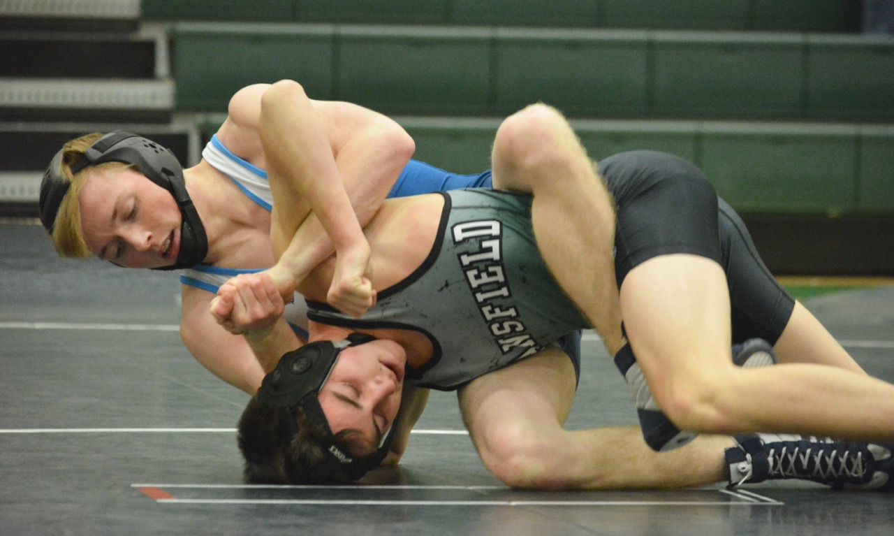Ian Bakalars won his match at 113 pounds by pin, as Franklin rolled to a big win over Mansfield and clinched a share of the Kelley-Rex dual meet title. (Josh Perry/HockomockSports.com)
