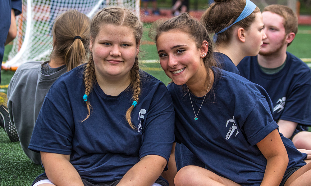 Partners and athletes enjoy a break on the infield in between events. (Peter Raider/HockomockSports.com)