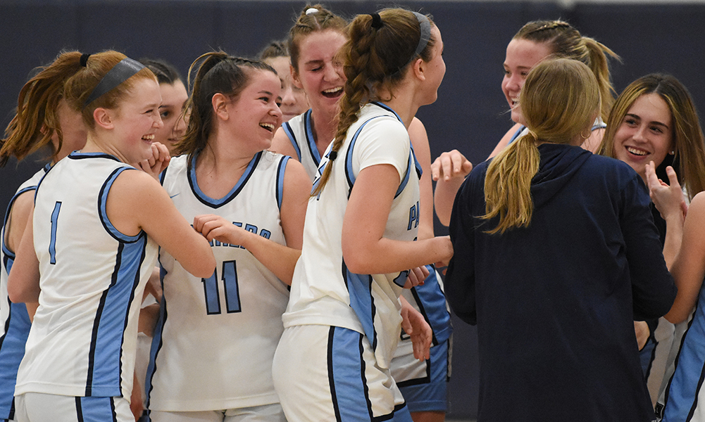 Franklin players celebrated on the court after their fourth quarter rally to sweep Attleboro and secure the program’s fifth straight league title. (Josh Perry/HockomockSports.com)