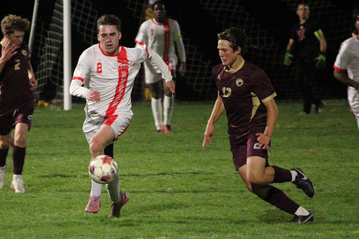 North Attleboro boys soccer North Attleboro's Zach Goulart (2) looks to get past Sharon's Prithvi Siva (12) during Tuesday's game.