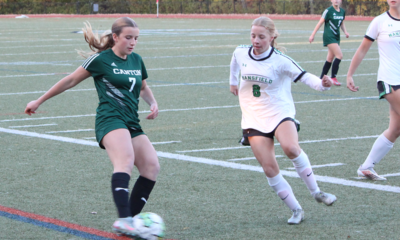 Canton girls soccer Natalie Erickson and Mansfield's Sarah Jones